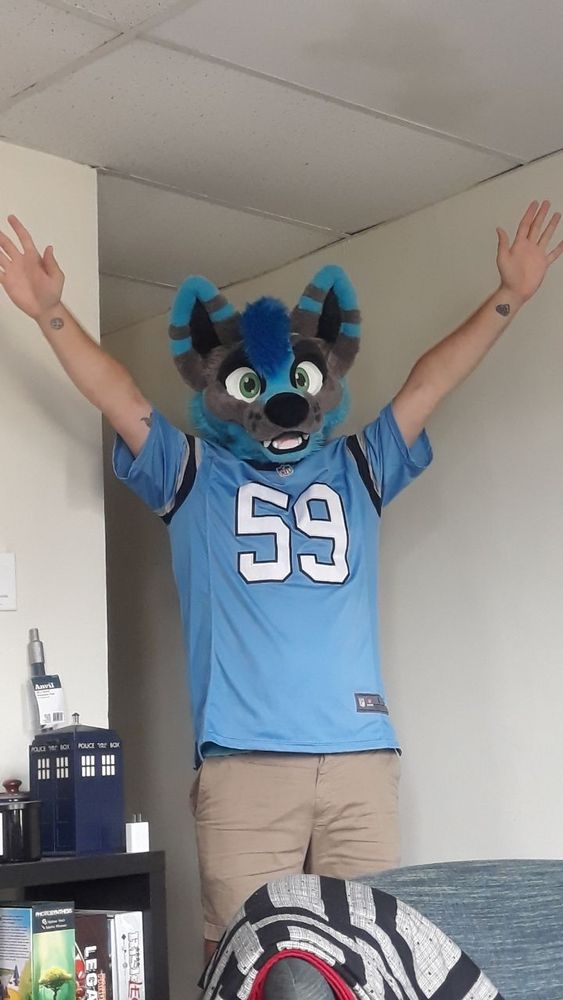 Big dumb idiot raises hands for team that will surely disappoint him