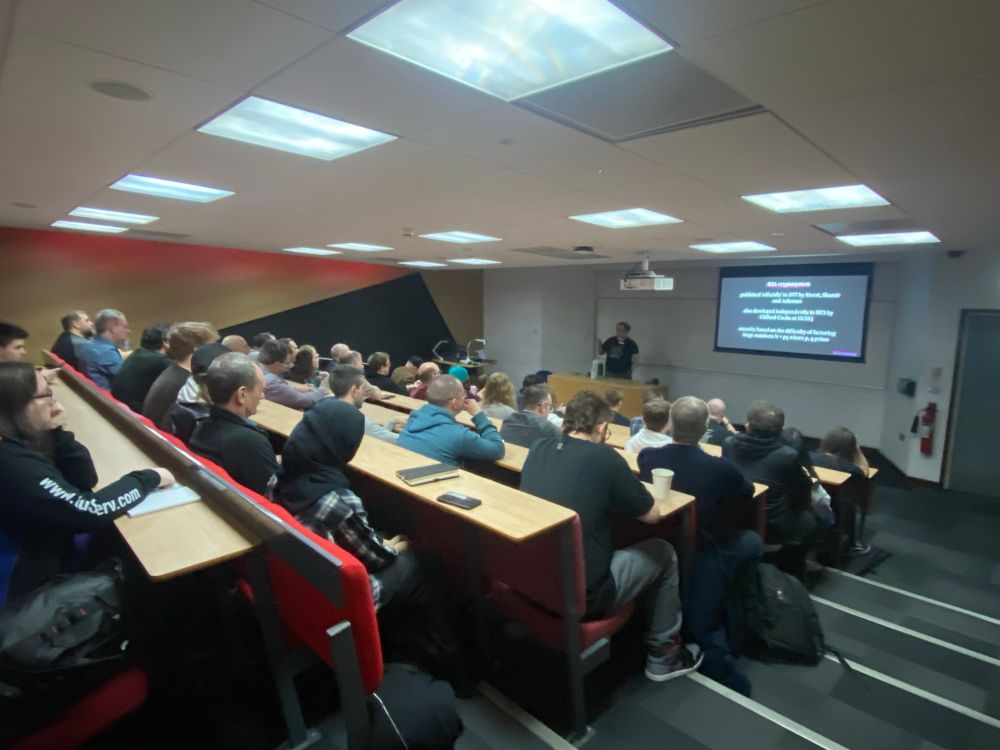 Picture showing attendees listening to a technical deep dive into Asymmetric Encryption at DDDNorth 2025