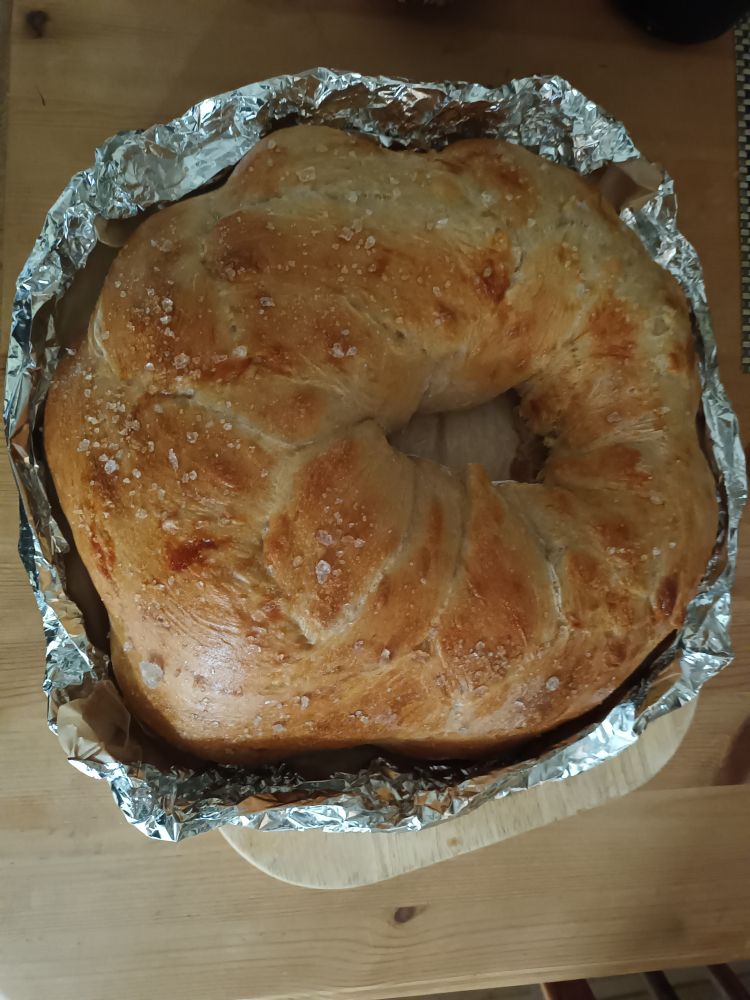 Photograph of a freshly baked loaf of bread of approximately circular form for tye Village harvest auction.