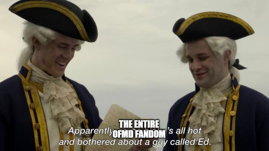Screencap of Our Flag Means Death Season 2 Episode 8 - Two British soldiers found Stede's lovely letter and are saying, 'Apparently, someone's all hot and bothered about a guy called Ed.' 'Someone' has been covered up with the words 'THE ENTIRE OFMD FANDOM'.
