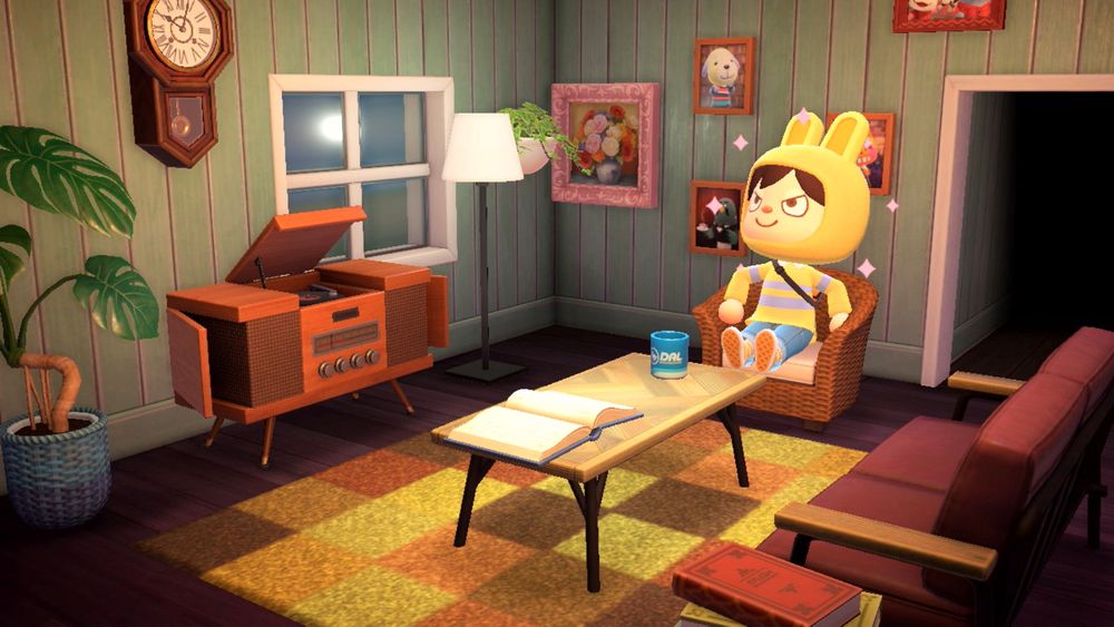 Cakemagic, proudly sitting in the armchair of the parlor. The scene shows off his radio, sleek coffee table, retro couch, grandfather clock, and framed embroidery. A few potted plants are seen bordering the left wall.