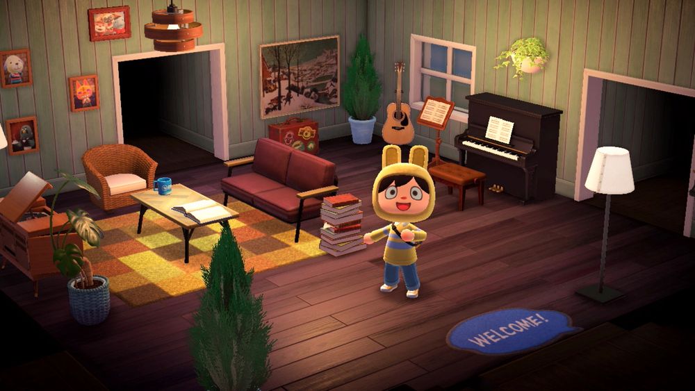 A Cake standing proudly, showing off his living room decorating skills. The living room has a distinct retro vibe to it, with an upright piano, a Magnavox radio and record player, a yellow rug on a dark wooden stained floor and a light green painted wood wall. Multiple tasteful pieces of art are hanging along the walls, and greenery compliments the setting nicely. A guitar is on display next to the piano, and the scene is warmly lit.