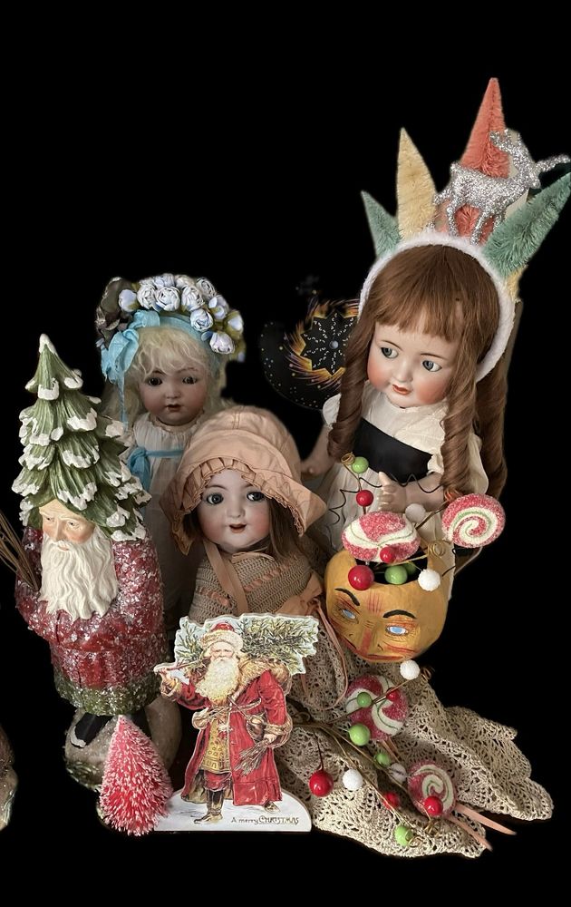 Photo of antique dolls by Kammer & Reinhardt and Franz Schmidt, all decked out for the holidays!
