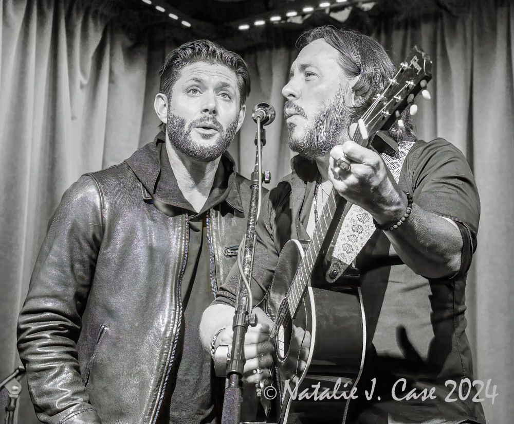 Jensen Ackles and Steve Carlson on stage at the Hotel Cafe, black and white, guitar