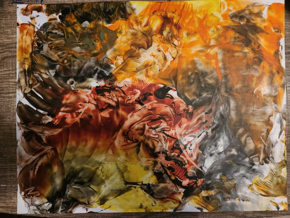 Abstract wax painting in yellow, orange, brown, and black.