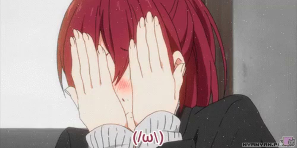 a girl with red hair is covering her face with her hands and the words nyanyan.pl is below her