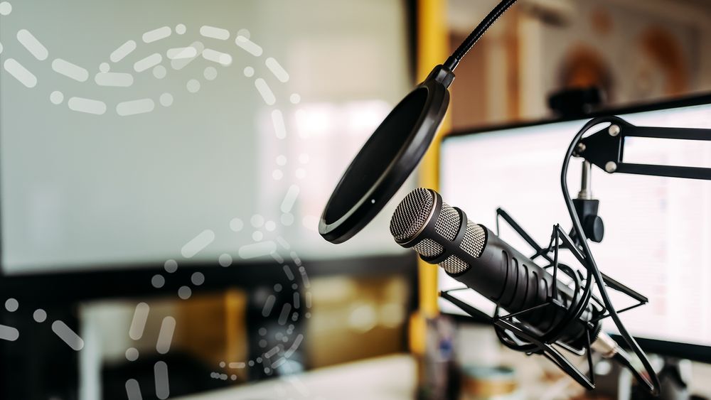 The image shows a microphone at a podcast recording studio.