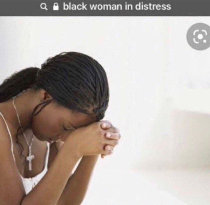 Black woman in distress (head down, next to praying hands)