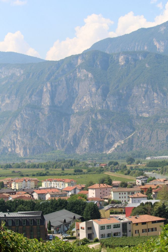 Photo of an Italian village set against mountains in the background