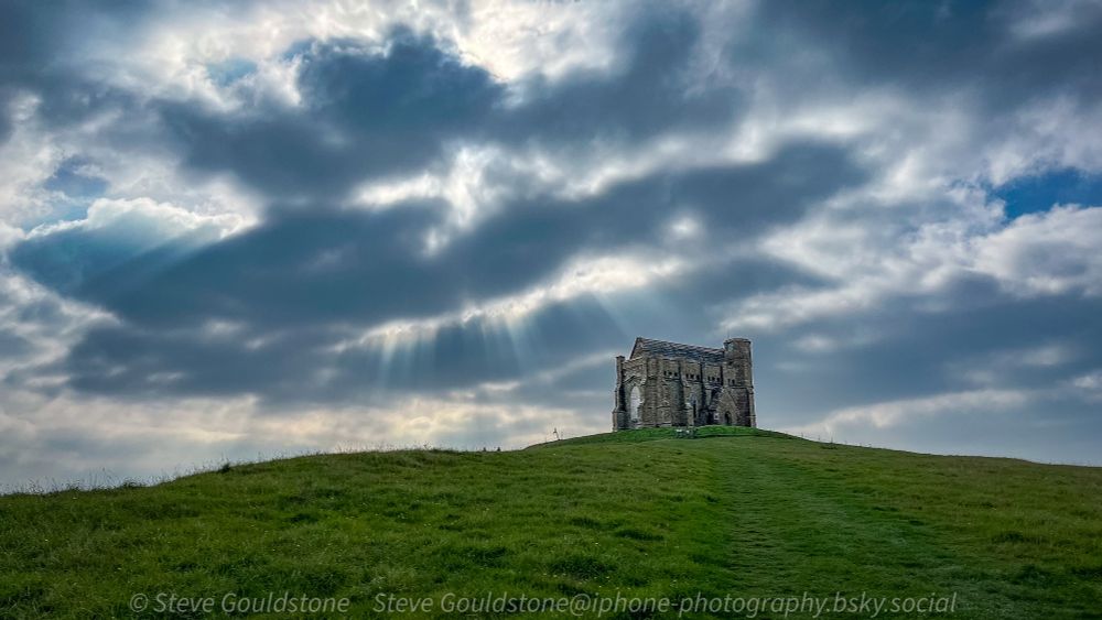 Autumnal day with sunburst through the clouds at St Catherine’s Chapel, Abbotsbury, Dorset,England.

Built in the 14th century the chapel fell into disuse after the dissolution of the monasteries in the 16th century. 