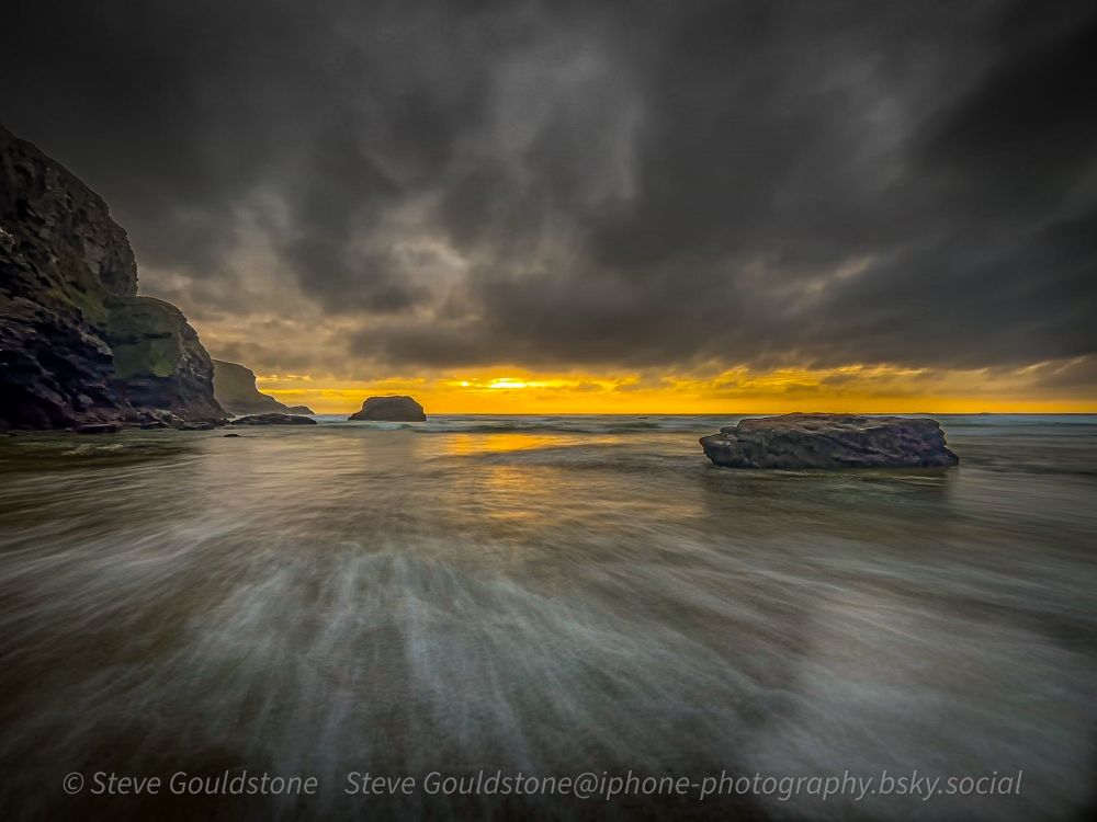 Mawgan Porth beach, sunset under stormy skies. Long exposure mode on iPhone 13 to capture the motion of the waves. Handheld.