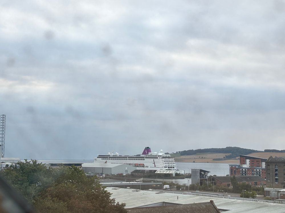 Photograph of a large cruise liner moored at Dundee harbour