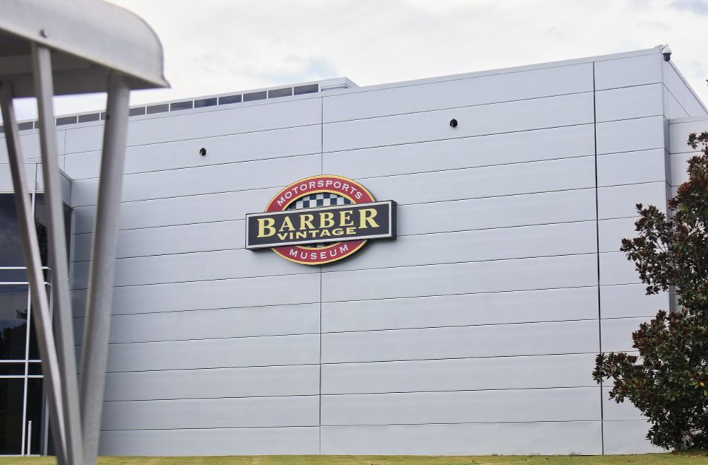 Barber Vintage Museum logo on the side of the museum building.
