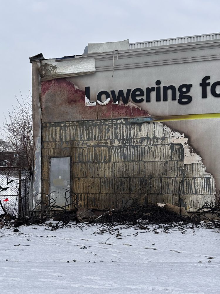 Snapshot of an exterior big brand grocery store wall that had been set on fire recently