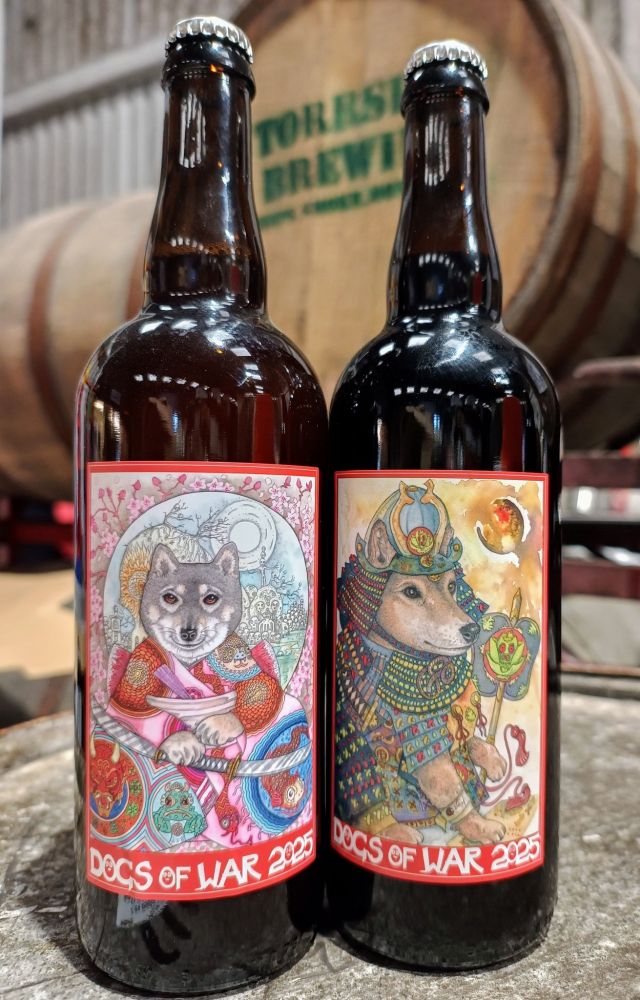 Artwork on 2 750ml beer bottles, one a Shinobi Shiba in a red & pink kimono with a two-bladed tachi, in front of a skull mountain and all surrounded with a sakura background; and one a Samurai Shiba in a Nobunaga era armour style & with a war fan, where the crest on the fan and helmet is a furiously angry hop. 