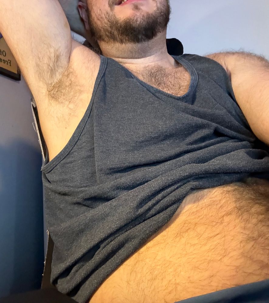 Me lifting the other arm, this time my tank top is raised showing my belly off a bit too