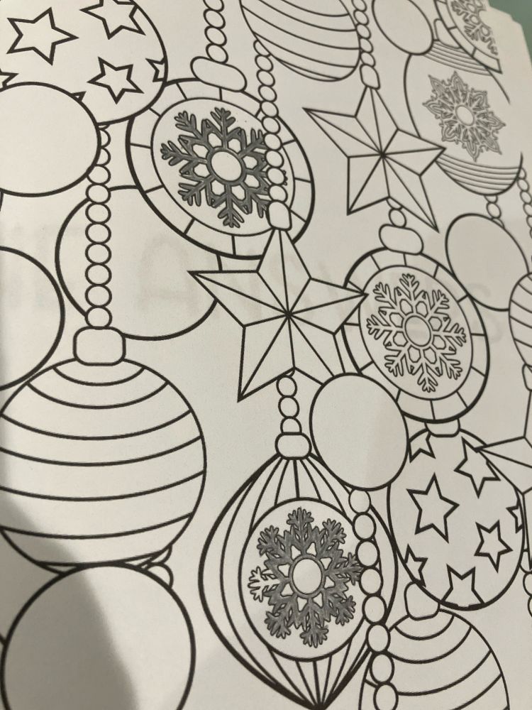 Coloring page featuring holiday ornaments, mostly uncolored, but with two or three intricate snowflakes colored in silver.