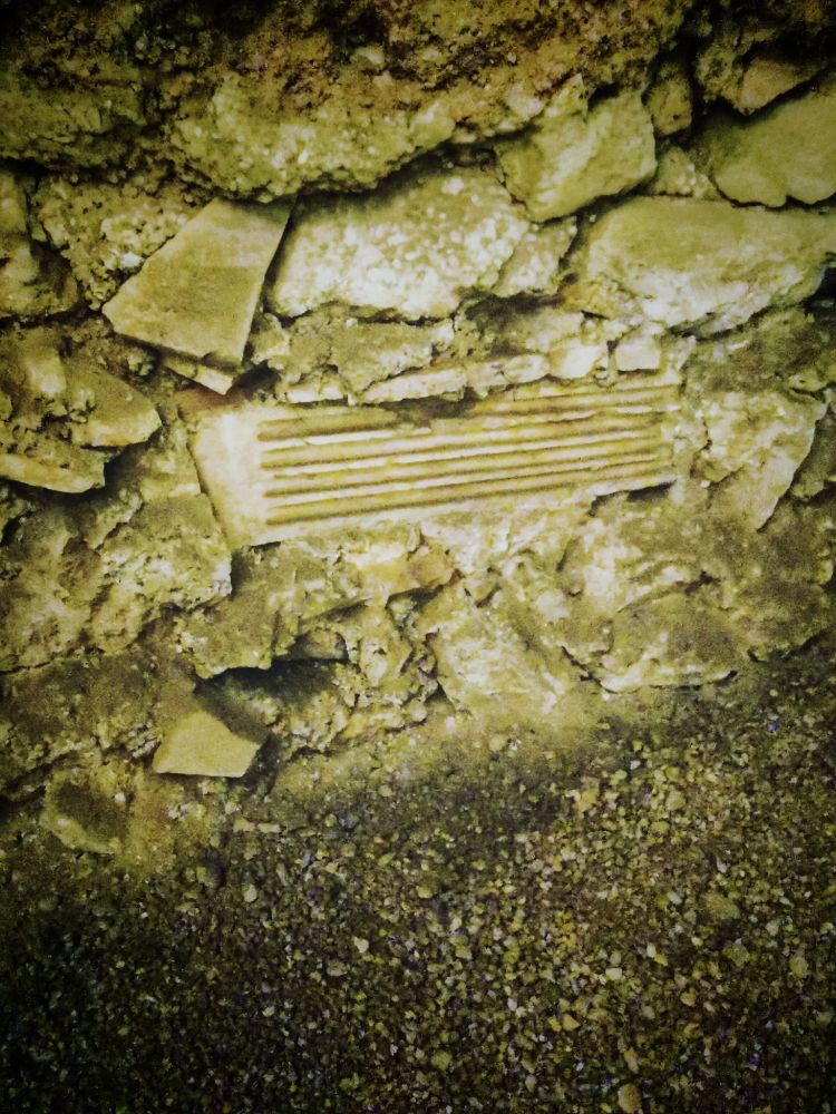 PILASTER, C. 140 CE, IN FOUNDATION, C18. OSPEDALE DI S. GIOVANNI IN LATERANO

The vast complex of the medieval and modern hospital of San Giovanni - Addolorata at the Lateran covers and conceals an aristocratic district with several large domus incuding the domus Anniorum, the huge residence of Annius Verus and his wife Domitia Lucilla, the parents of the emperor Marcus Aurelius. This broken marble pilaster, still in situ, comes from a garden peristyle with two pools. Between the pilasters, a marble transenna or balustrade separated the garden from the shady covered peristyle that surrounded it. 