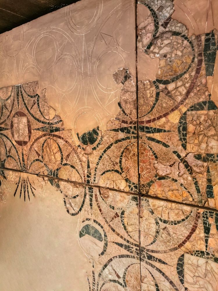 GEOMETRIC FLOOR IN OPUS SECTILE, C4 CE. ARCHAEOLOGICAL AREA OF THE OSPEDALE DI S. GIOVANNI

The discovery of two statue bases naming L. Licinius Sura give us the identity of the owner of a vast domus on the Caelian hill near the property of the Plautii Laterani, of a similar date, which gave the toponym "Lateran" to the cathedral of Rome. Sura was a general under the emperor Tiberius and an ancestor of the Licinius Sura who was a close friend (lover?) of the early C2 emperor Trajan. The latter Licinius Sura had a different house on the slope of the Aventine. The Lateran domus of the Licinii Surae had extensive gardens making use of the huge amount of aqueduct water that crossed the area, and a gigantic cistern remains to show part of the property's hydraulic work. This floor in serpentino, porphyry, giallo antico, and other marbles was found in a room adjoining the garden. 