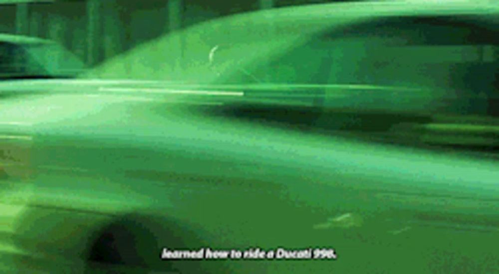 a green car with the words learned how to ride a ducati 996 on it