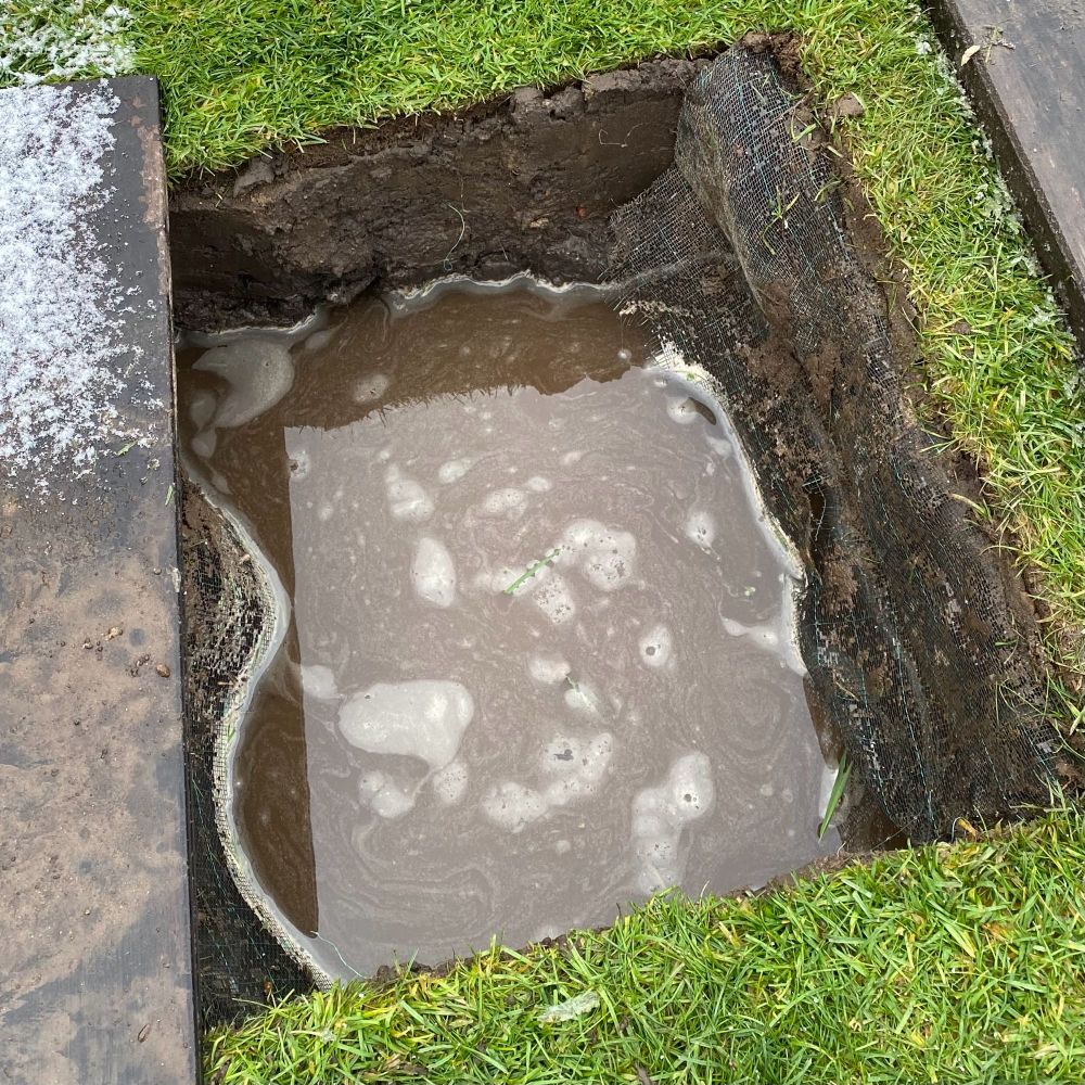 Digged hole flooded due to a high level of groundwater.