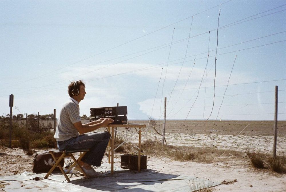 Photograph of Alan Lamb with recording equipment outdoors in Australia. 
