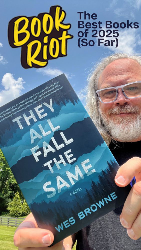 Old looking guy with a beard holding the book They All Fall the Same in front of a blue and cloudy sky.