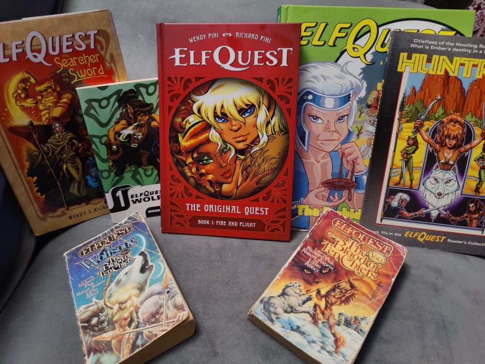 7 books from my elfquest collection. Graphic novels and novels of the 10 Chiefs. Prominent in the middle, the brand new elfquest book the original quest book 1 fire and flight.