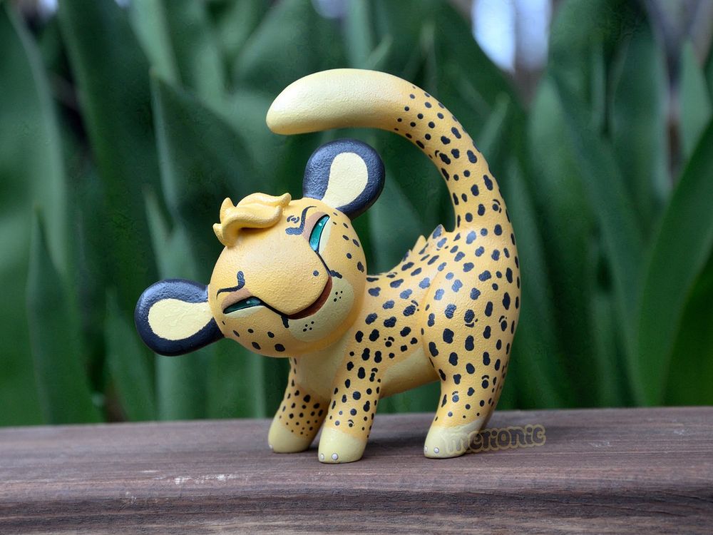 A handmade figurine of a cheetah character.