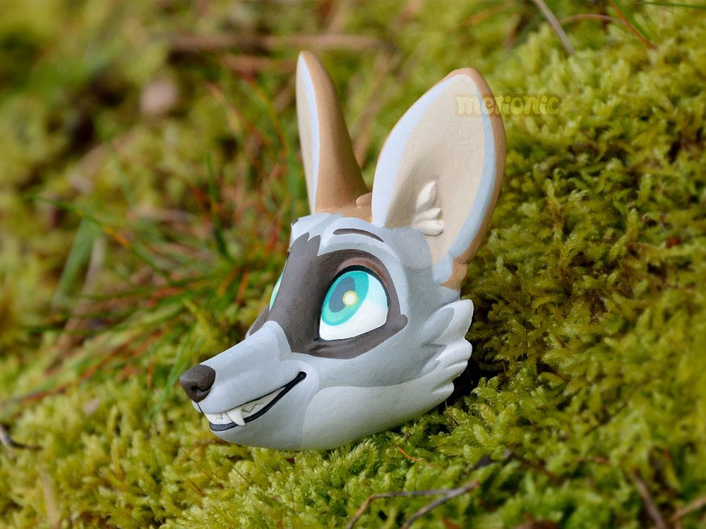 A handmade fridge magnet. It's a bat-eared fox!