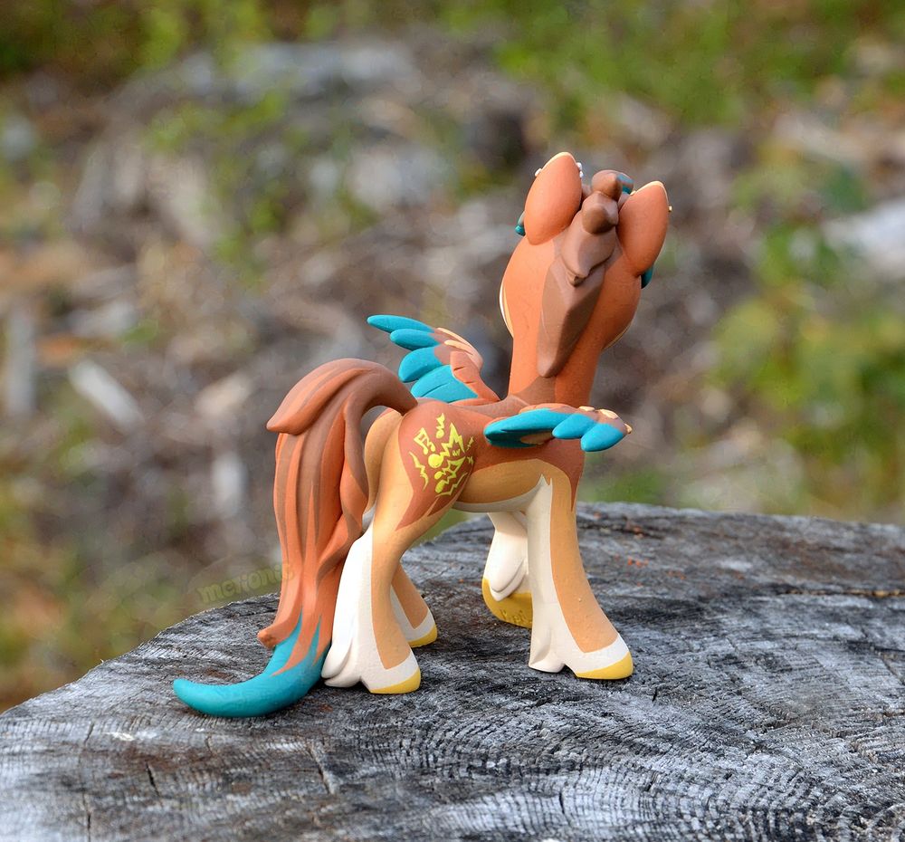 A handmade figurine of a pegasus character.