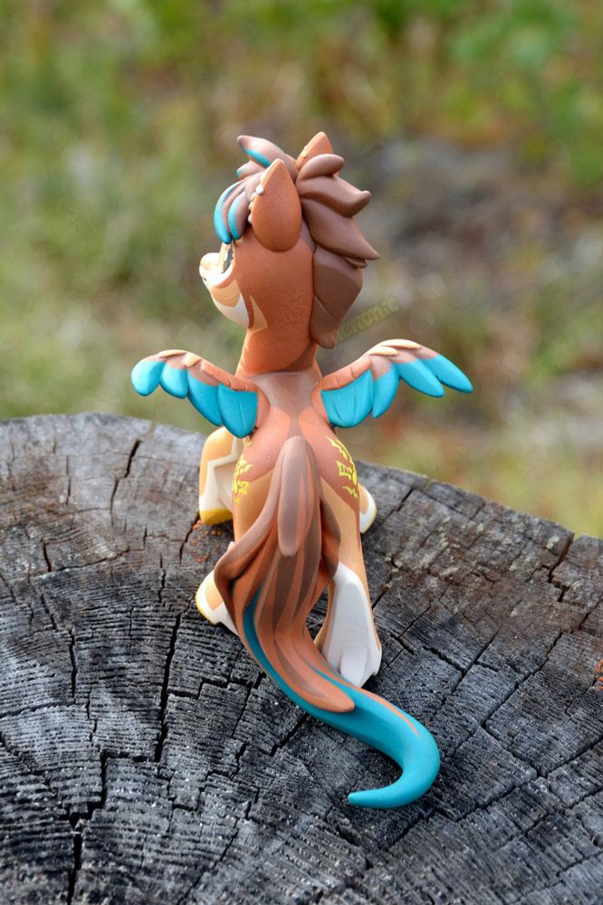 A handmade figurine of a pegasus character.