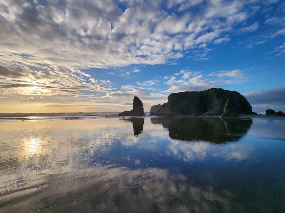 Bandon beach at low tide with beautiful reflection on the sand.