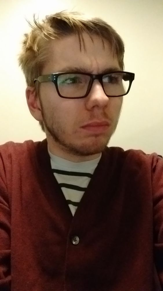 maisie 10 years ago with a grumpy face and messy beard 