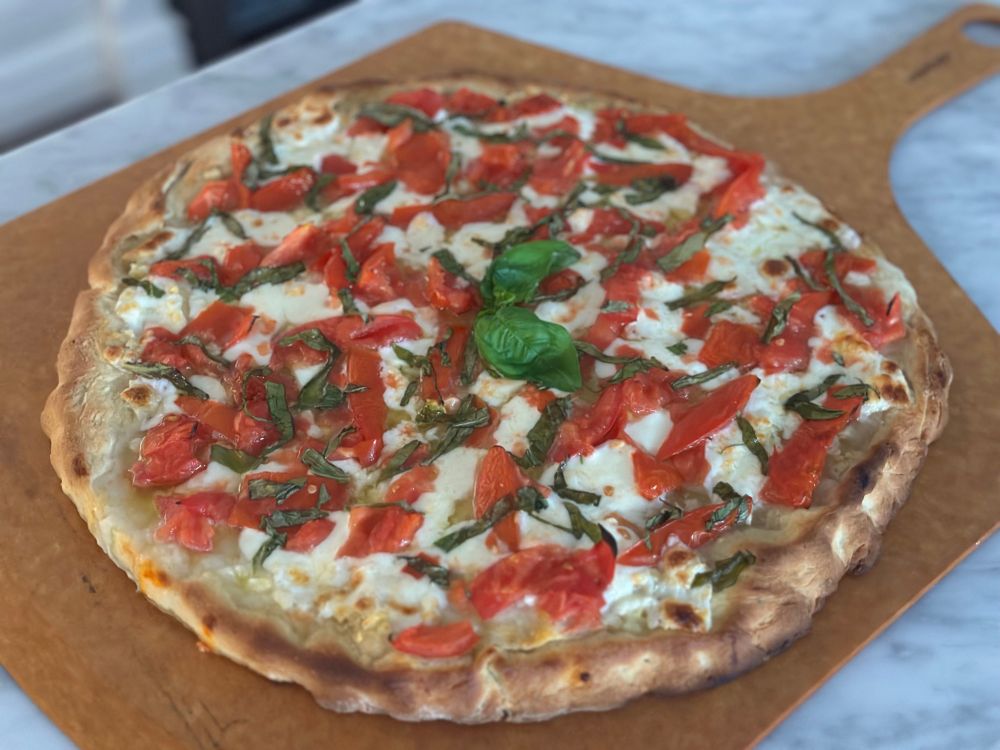 A margherita pizza fresh from the oven