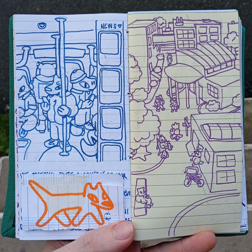 An opened sketchbook with drawings of a scene in a subway and an air view of a college campus