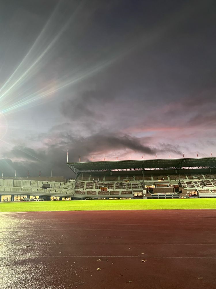 Sunset at the track last week. Dark purple and pink sky mixed with deep grey clouds that almost resembled a runners leg.