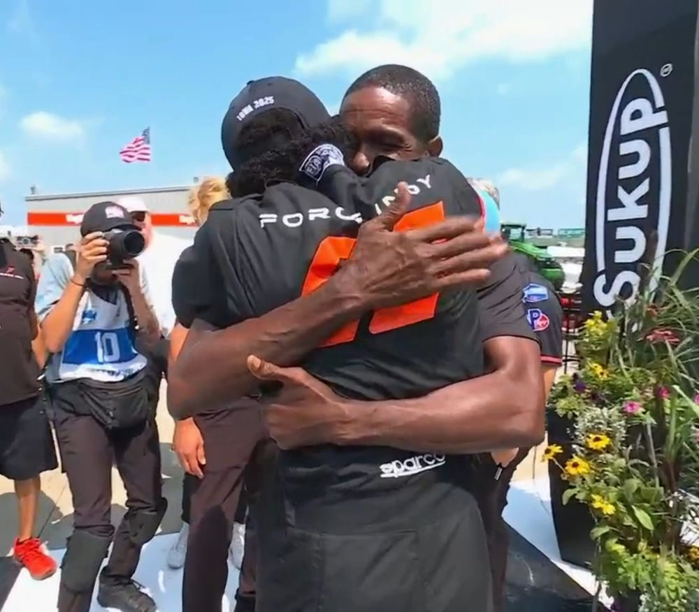Wayne Rowe hugs his son, Myles Rowe, who just won his first IndyCar NXT race at Iowa Speedway on July 12, 2025
