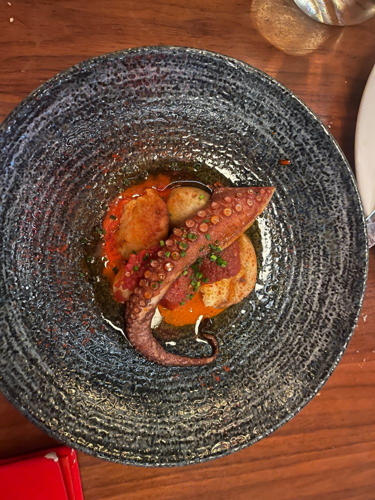 Octopus a la brasa on 6 hour cooked potatoes with tomato confit and finally a sweetish pepper puree. 