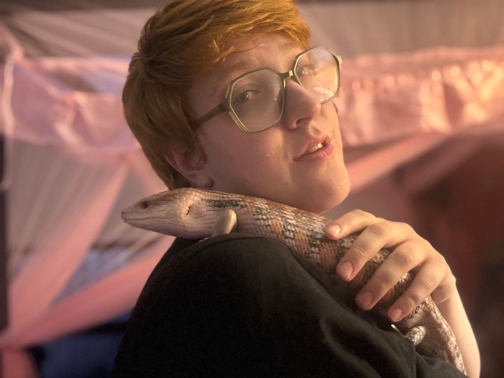 Photo of Gitsie with Polygon on her shoulder. 