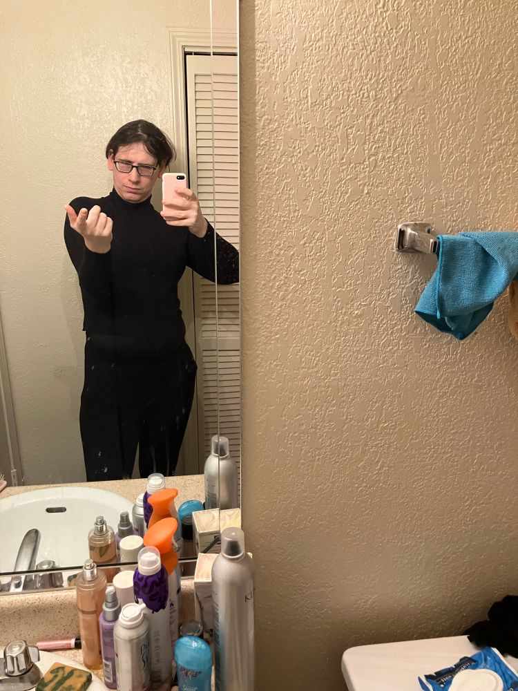 Black turtleneck sweater, black leggings, black shapewear to accentuate the upfronts