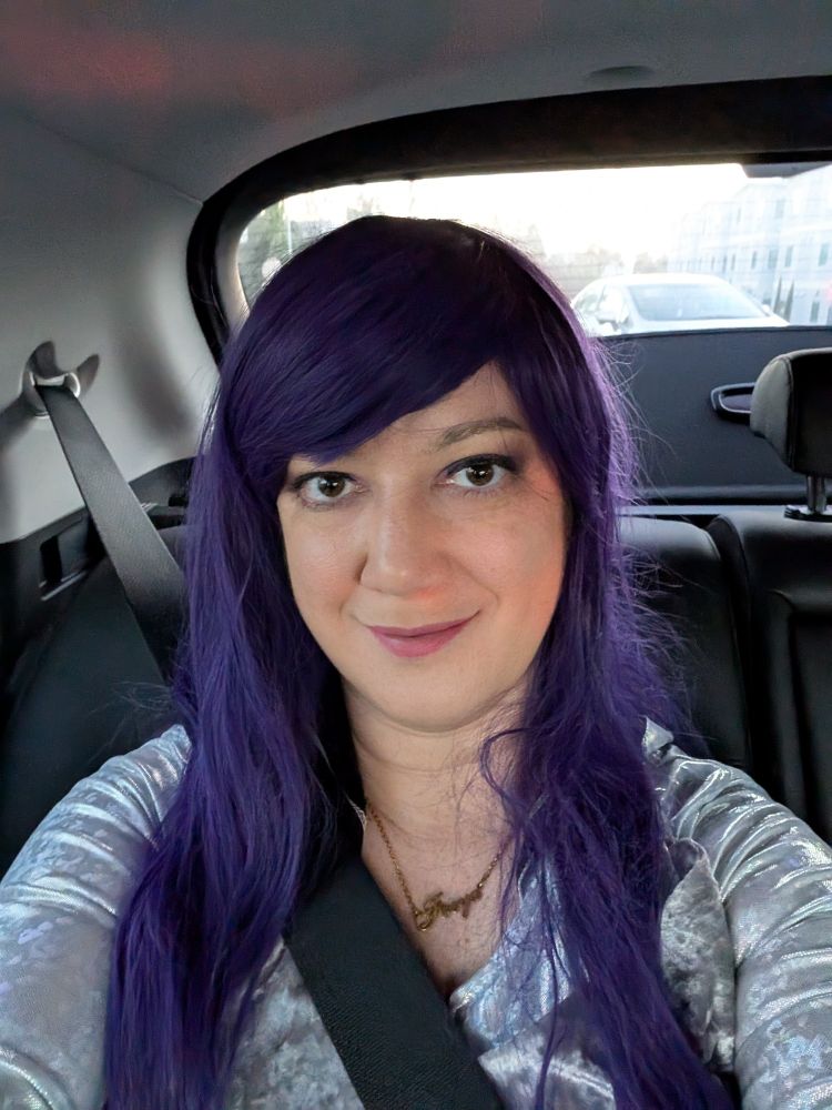Car selfie of me with a purple wig. 