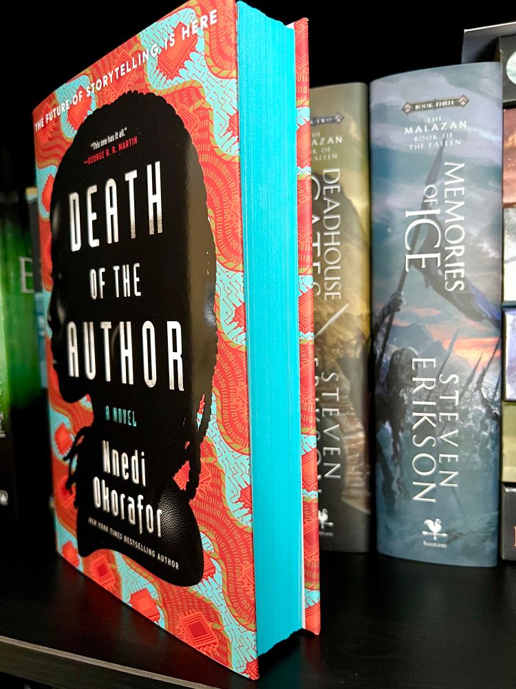 Blue edging pictured from the side view of the special edition of Death Of The Author by Nnedi Okorafor. 