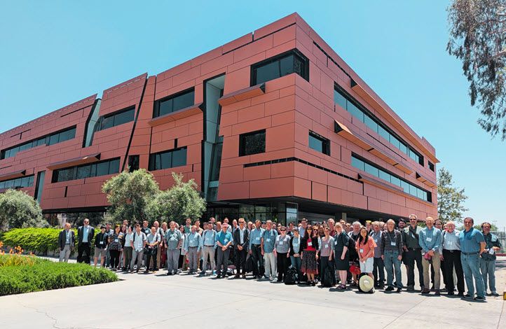 This is a group photo of approximately 65 astronomers who attended the PRIMA working meeting in person. The event was held on the Caltech campus May 19-21, 2025. The group is standing on the sidewalk in front of the Cahill Center for Astronomy and Astrophysics. Image credit: Caltech/IPAC-Marcy Harbut