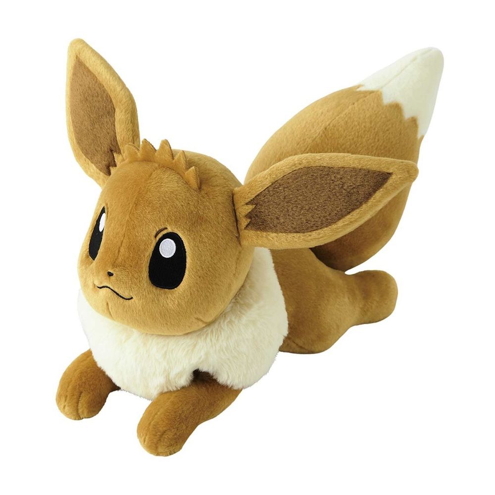 A life-size (16 in) plushie of the Pokémon Eevee. He's laying down comfortably on his belly with his paws stretched out in front of and behind him, his eyes looking forward confidently and a smug stitched-on smile~
