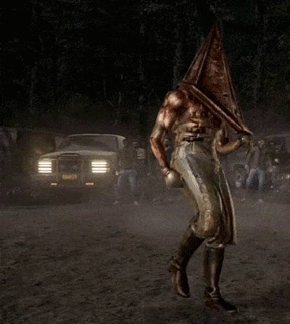 pyramid head in a video game standing in the dirt