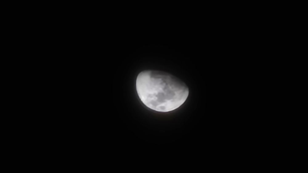 Waxing moon in a dark sky