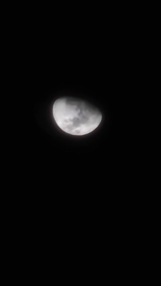 Waxing moon in a dark sky