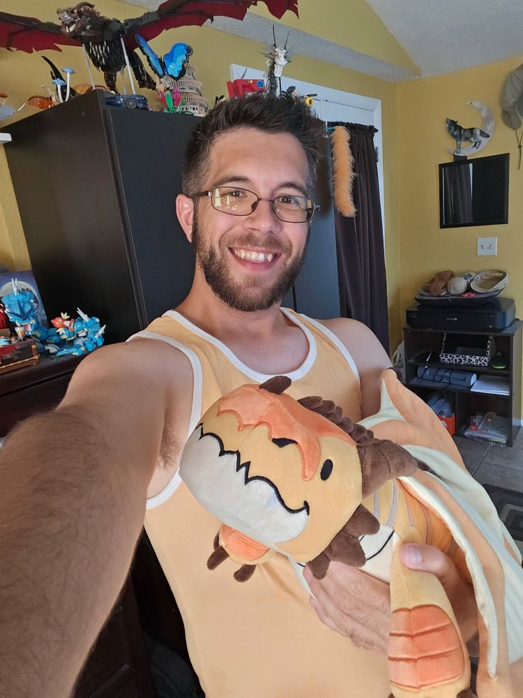 Me holding the yellow dragon plush, for size reference!
