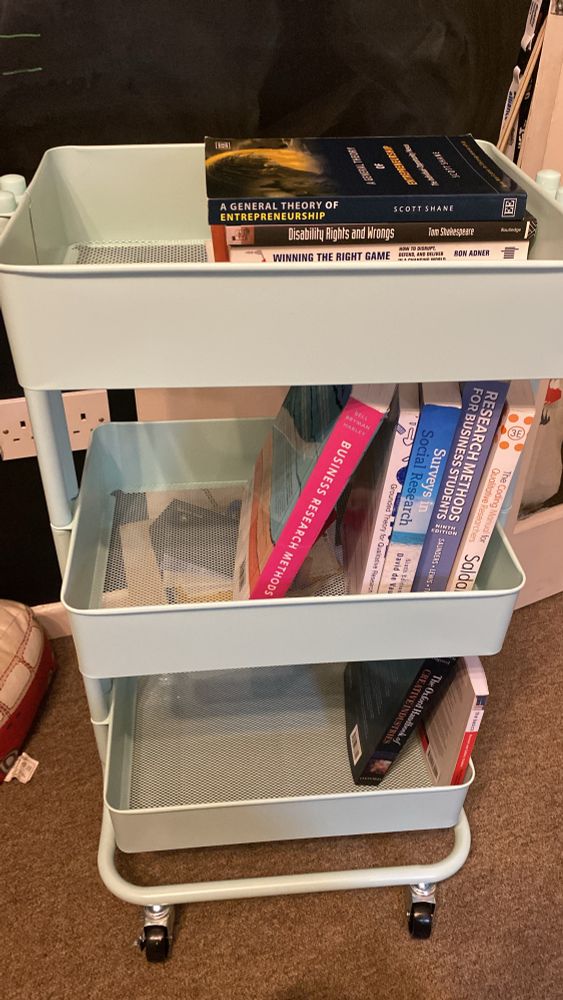 A library trolly with books in Cambridge light blue 